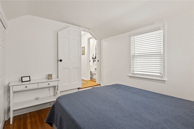 144 Montclair Dr, Irondequoit, NY 14617 - bedroom with lofted ceiling, wood finished floors, ensuite bath, and arched walkways