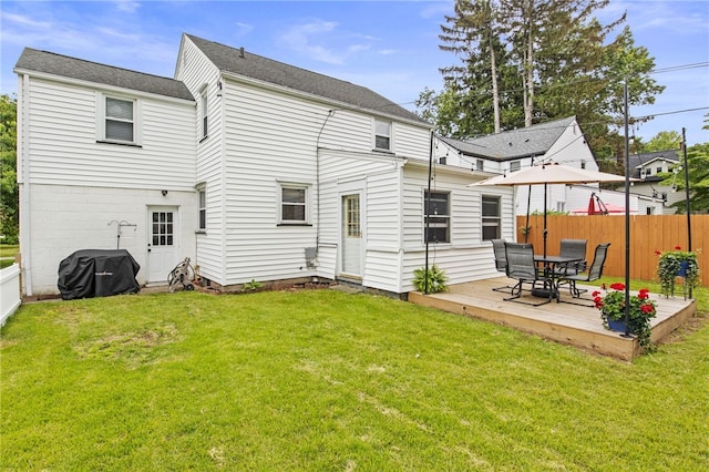 144 Montclair Dr, Irondequoit, NY 14617 - back of property with a fenced backyard and a wooden deck