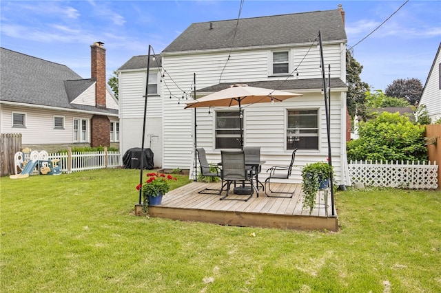144 Montclair Dr, Irondequoit, NY 14617 - rear view of property featuring a deck, a fenced backyard, outdoor dining space, and roof with shingles