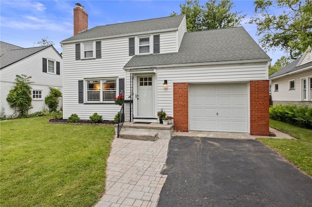 144 Montclair Dr, Irondequoit, NY 14617 - traditional-style home with a front lawn, a chimney, a garage, driveway, and roof with shingles