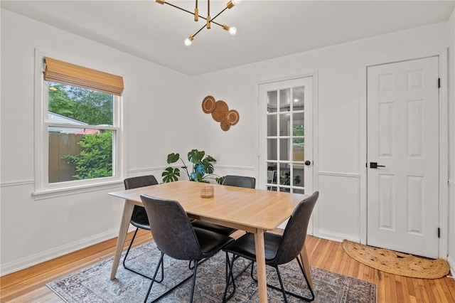 144 Montclair Dr, Irondequoit, NY 14617 - dining room with a chandelier and light wood-type flooring