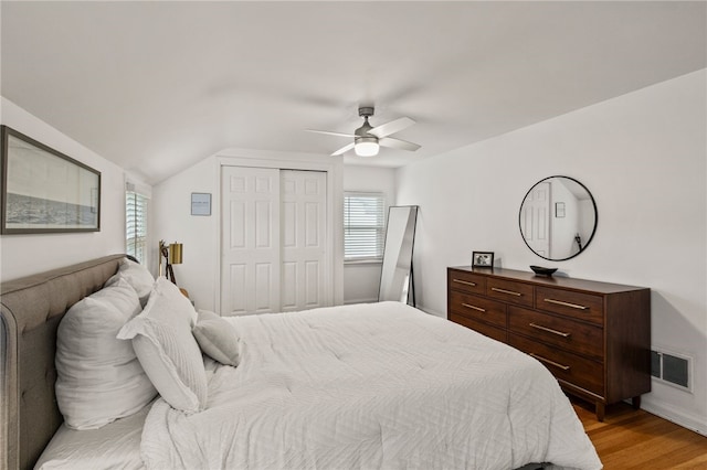 144 Montclair Dr, Irondequoit, NY 14617 - bedroom featuring a closet, light wood-type flooring, lofted ceiling, and ceiling fan