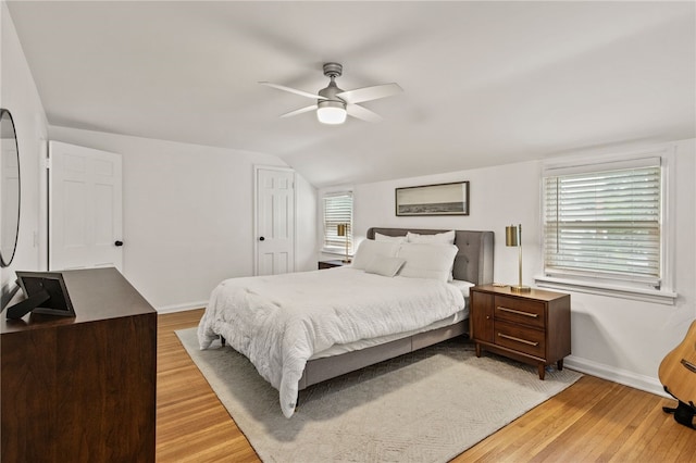 144 Montclair Dr, Irondequoit, NY 14617 - bedroom featuring light wood-type flooring, vaulted ceiling, and ceiling fan