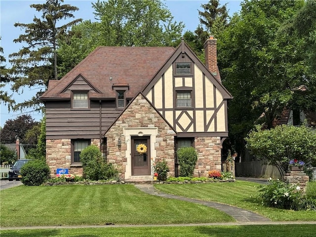 283 Bonnie Brae Ave, Brighton, NY 14618 - english style home featuring stone siding, a front lawn, stucco siding, and a chimney