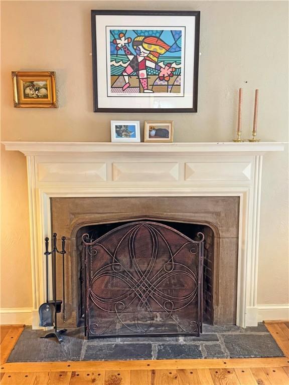 283 Bonnie Brae Ave, Brighton, NY 14618 - detailed view of a fireplace with flush hearth and baseboards
