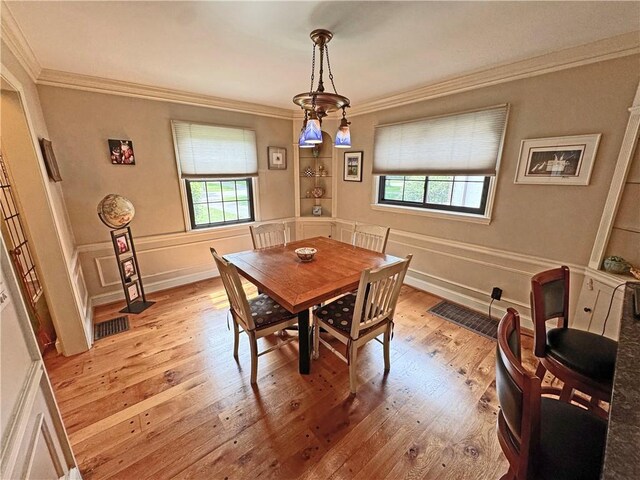 283 Bonnie Brae Ave, Brighton, NY 14618 - dining area featuring plenty of natural light, light wood-style floors, and crown molding