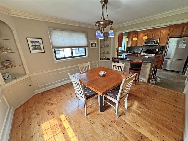 283 Bonnie Brae Ave, Brighton, NY 14618 - dining room with ornamental molding and light wood-style floors