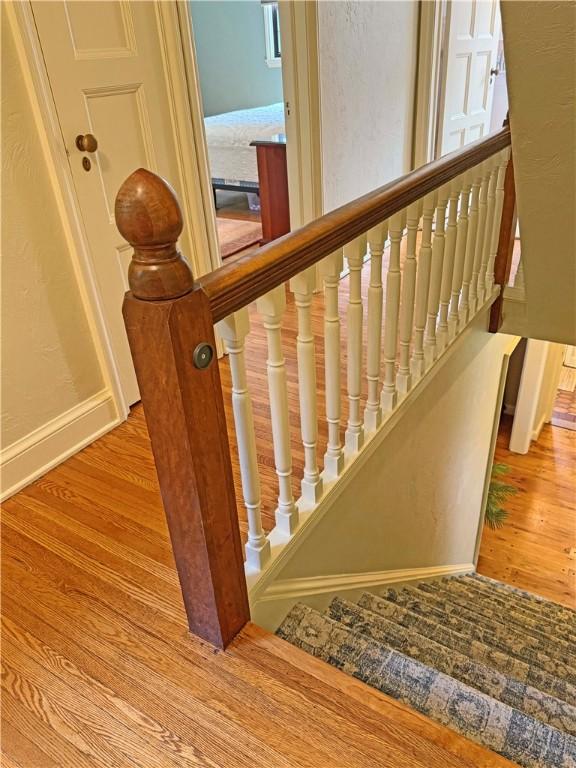 283 Bonnie Brae Ave, Brighton, NY 14618 - stairs with wood finished floors and baseboards
