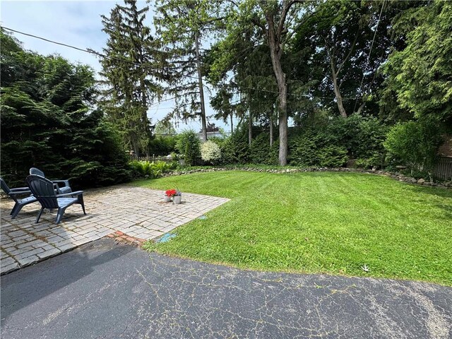 283 Bonnie Brae Ave, Brighton, NY 14618 - view of green lawn with a patio