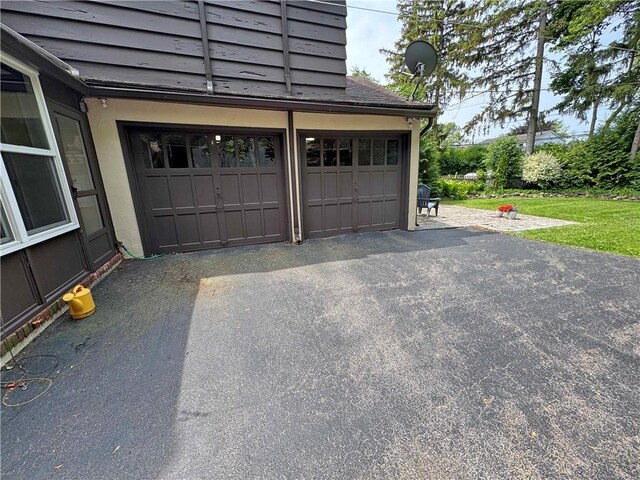 283 Bonnie Brae Ave, Brighton, NY 14618 - garage featuring asphalt driveway