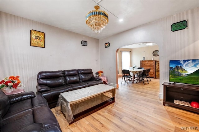 1083 E Lovejoy St, Buffalo, NY 14206 - living area featuring arched walkways and light wood-type flooring