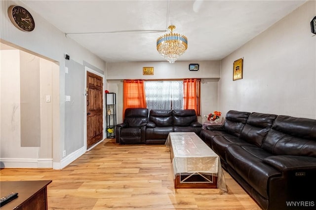1083 E Lovejoy St, Buffalo, NY 14206 - living area featuring light wood-style flooring and a chandelier