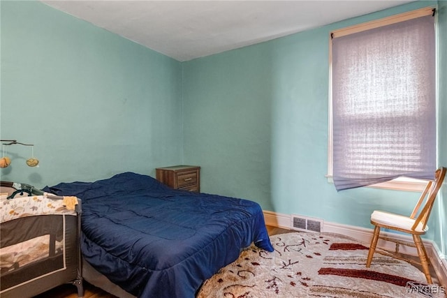 1083 E Lovejoy St, Buffalo, NY 14206 - bedroom with baseboards and wood finished floors