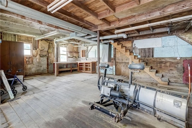 4618 Oak Orchard Rd, Barre, NY 14411 - below grade area featuring stairway, hardwood / wood-style flooring, and wooden walls