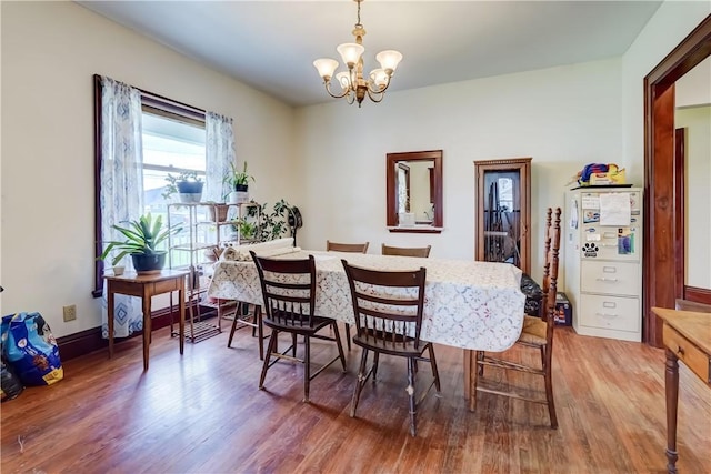 4618 Oak Orchard Rd, Barre, NY 14411 - dining area featuring a chandelier and wood finished floors