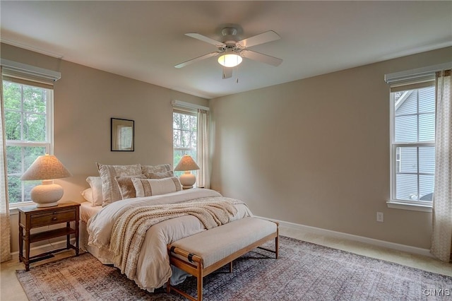 8497 Melo Cir, Clay, NY 13041 - bedroom featuring multiple windows, ceiling fan, and light carpet