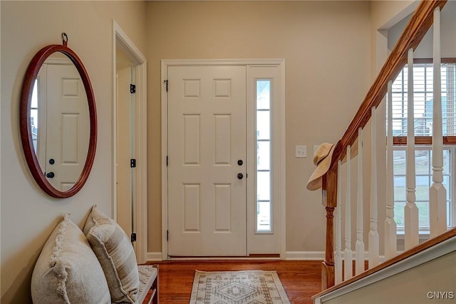 8497 Melo Cir, Clay, NY 13041 - foyer entrance with healthy amount of natural light, wood finished floors, and stairway