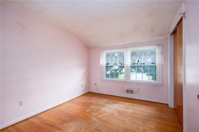 170 Kings S, Irondequoit, NY 14617 - spare room with light wood-style flooring and lofted ceiling