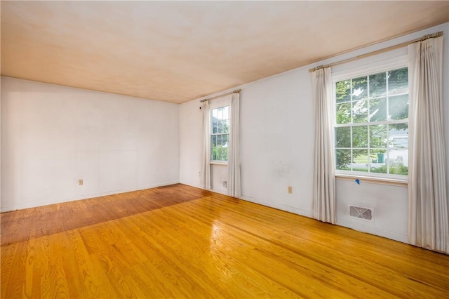 170 Kings S, Irondequoit, NY 14617 - empty room with healthy amount of natural light and wood finished floors