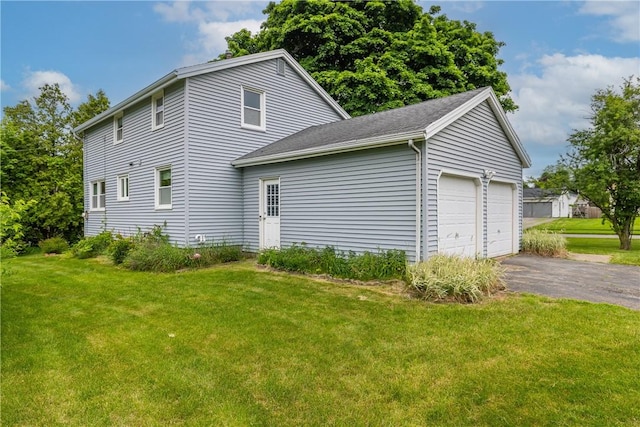 170 Kings S, Irondequoit, NY 14617 - view of home's exterior with a lawn, a garage, and a shingled roof