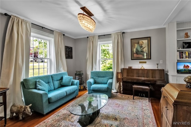 2565 Bowen Rd, Elma, NY 14059 - living room featuring wood finished floors, ornamental molding, and built in shelves