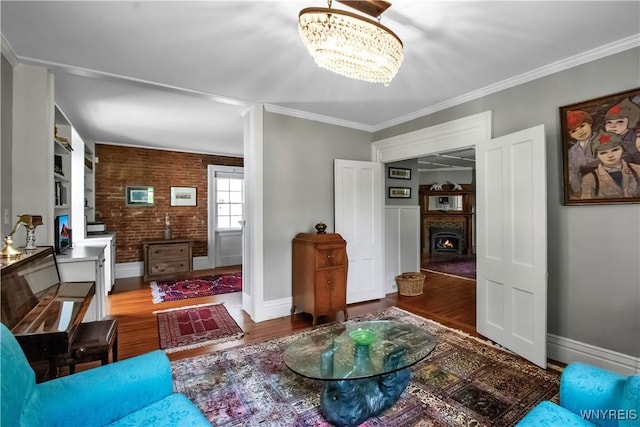2565 Bowen Rd, Elma, NY 14059 - living area featuring a chandelier, wood finished floors, and ornamental molding
