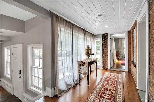 2565 Bowen Rd, Elma, NY 14059 - hall featuring brick wall, wood finished floors, wood ceiling, and recessed lighting