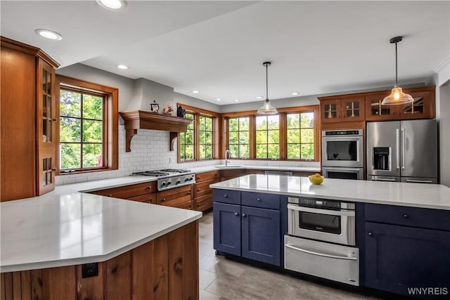 2565 Bowen Rd, Elma, NY 14059 - kitchen featuring appliances with stainless steel finishes, a warming drawer, light countertops, healthy amount of natural light, and recessed lighting