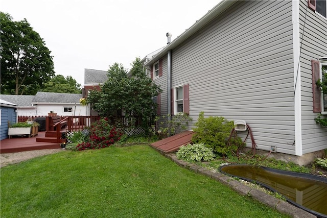 11 Fulton St, North Dansville, NY 14437 - view of grassy yard with a wooden deck