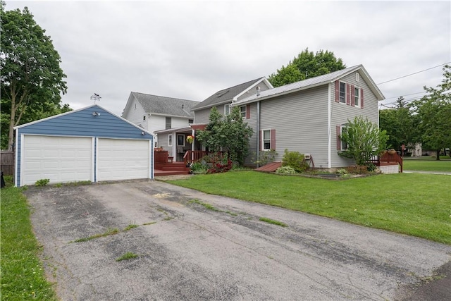 11 Fulton St, North Dansville, NY 14437 - view of front of property with an outdoor structure, a detached garage, a deck, and a front lawn