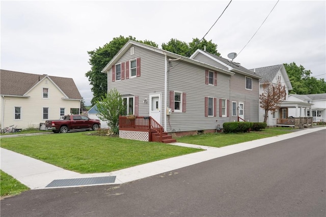 11 Fulton St, North Dansville, NY 14437 - view of front of house with a front lawn