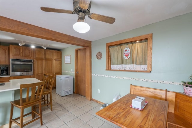 11 Fulton St, North Dansville, NY 14437 - kitchen with oven, fridge, light countertops, brown cabinets, and light tile patterned flooring