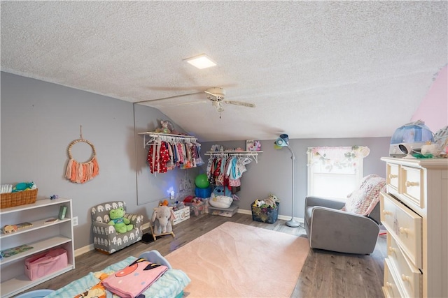 11 Fulton St, North Dansville, NY 14437 - bedroom with a textured ceiling, lofted ceiling, wood finished floors, and a ceiling fan