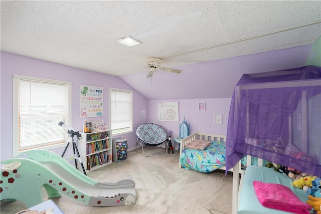 11 Fulton St, North Dansville, NY 14437 - bedroom featuring vaulted ceiling, carpet floors, ceiling fan, and a textured ceiling