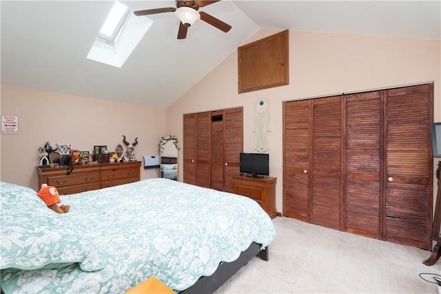 11 Fulton St, North Dansville, NY 14437 - carpeted bedroom featuring two closets, a skylight, a ceiling fan, and high vaulted ceiling