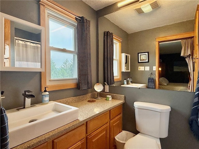 3 Suncrest Ter, Oneonta-City, NY 13820 - bathroom with plenty of natural light, vanity, and a textured ceiling