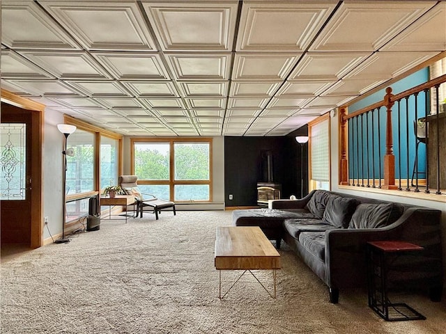 3 Suncrest Ter, Oneonta-City, NY 13820 - carpeted living area featuring an ornate ceiling, healthy amount of natural light, and a wood stove