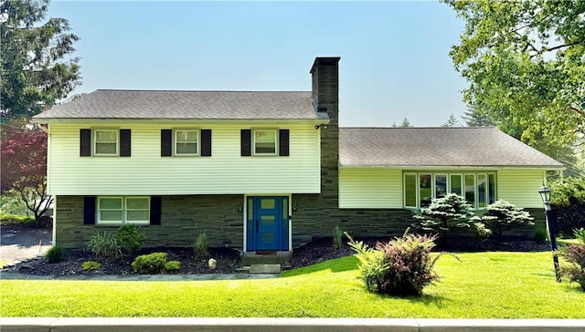 3 Suncrest Ter, Oneonta-City, NY 13820 - split level home featuring a chimney, a front lawn, and stone siding