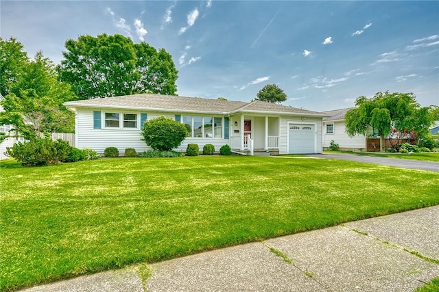 26 Catalina Dr, Irondequoit, NY 14622 - ranch-style house with an attached garage, driveway, and a front lawn