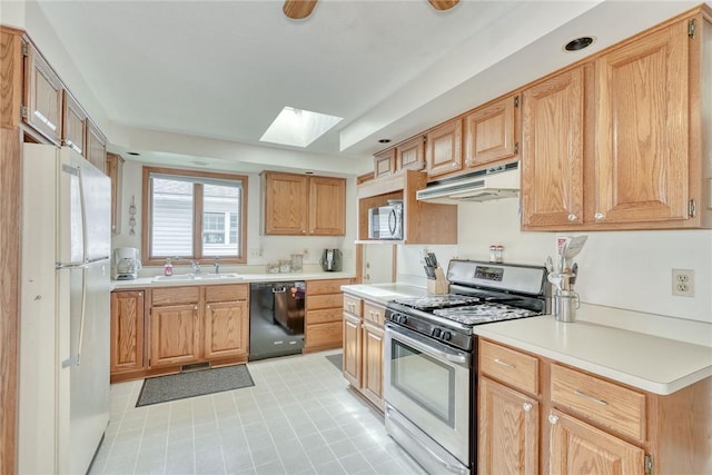 26 Catalina Dr, Irondequoit, NY 14622 - kitchen featuring stainless steel appliances, under cabinet range hood, a skylight, and light countertops