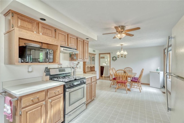 26 Catalina Dr, Irondequoit, NY 14622 - kitchen featuring stainless steel gas stove, under cabinet range hood, light countertops, ceiling fan, and a chandelier