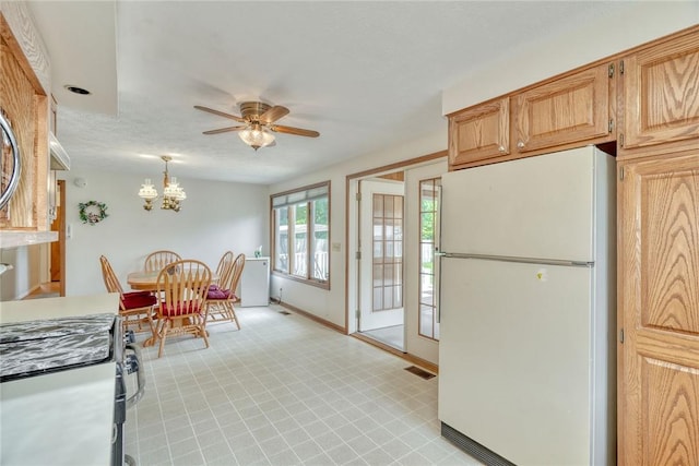 26 Catalina Dr, Irondequoit, NY 14622 - kitchen featuring freestanding refrigerator, a ceiling fan, hanging light fixtures, a chandelier, and stove