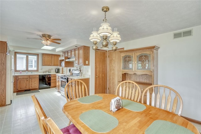26 Catalina Dr, Irondequoit, NY 14622 - dining area with a chandelier, a textured ceiling, and ceiling fan