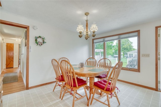 26 Catalina Dr, Irondequoit, NY 14622 - dining room featuring a chandelier and a textured ceiling