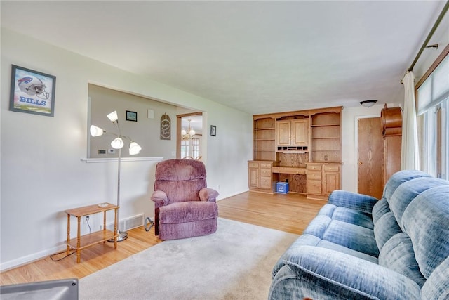 26 Catalina Dr, Irondequoit, NY 14622 - living room featuring light wood-style floors and baseboards