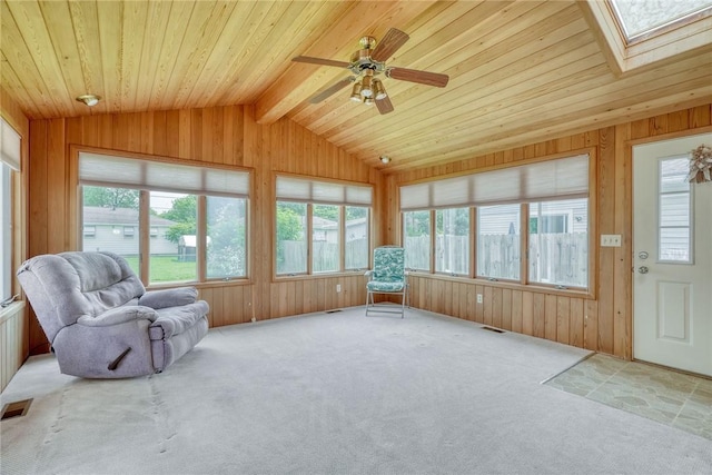 26 Catalina Dr, Irondequoit, NY 14622 - sunroom / solarium with vaulted ceiling, carpet, healthy amount of natural light, wooden walls, and a skylight