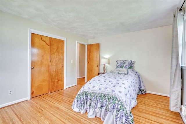 26 Catalina Dr, Irondequoit, NY 14622 - bedroom featuring wood finished floors and a closet