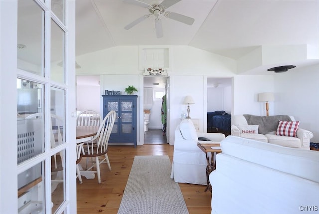 11713 Rays Bay Rd, Henderson, NY 13650 - living area featuring wood finished floors, a ceiling fan, and lofted ceiling