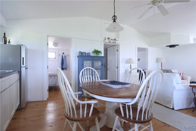 11713 Rays Bay Rd, Henderson, NY 13650 - dining space featuring vaulted ceiling, ceiling fan, and light wood-style flooring