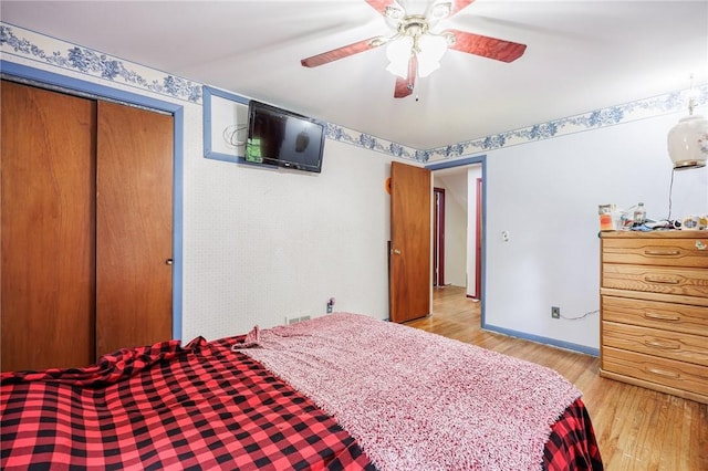 77 Chad Cir, Greece, NY 14616 - bedroom with light wood-type flooring, a ceiling fan, and a closet